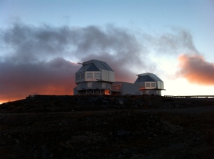 The twin, "regular" Magellan Telescopes with dramatic cloud backdrop. That's Baade on the left and Clay on the right. Used 'em both. Love 'em both.